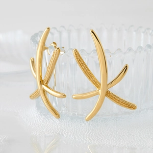 French style gold starfish earrings with minimalist cross design on glass edge