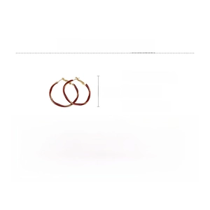 Detail view of red and gold alloy hoop earrings with specific weight and size parameters