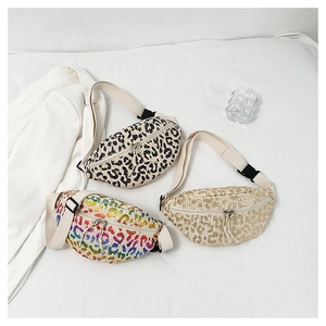 Detailed flat lay of stylish beach fanny packs in leopard print and woven textures
