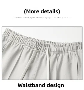 Detail of light gray elastic waistband with white drawstrings on casual joggers