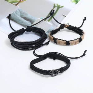 Detailed view of 3-piece vintage leather bracelet set with tree of life metal pendant