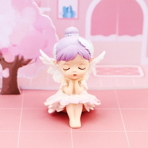 Detailed close-up of a sitting purple hair ballet angel figurine with white wings