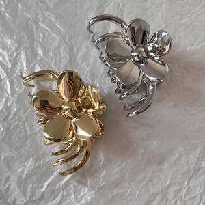 French flower metal hair claws in gold and silver finish for stylish hair styling