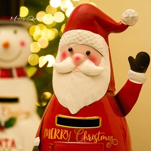 Red metal Santa Claus mailbox christmas decoration for festive home holiday scene setup