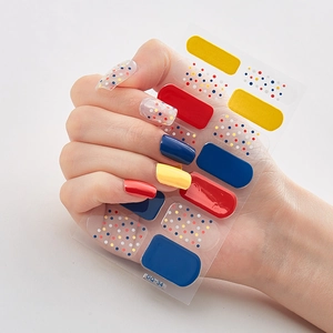 Detail of 3D laser nail art stickers featuring red, yellow, and blue dots on model hands