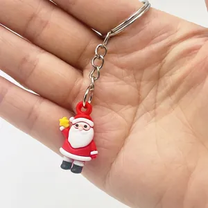 Detailed view of a 2.5cm mini Santa Claus keychain made of soft PVC with metal ring