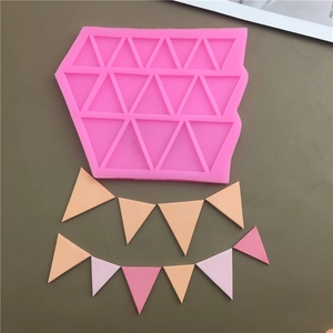 Detailed pink silicone mold for creating triangle banner shapes for fondant cake decor