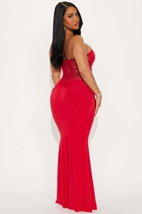 Detail of red tube top dress with sheer mesh stitching and fishtail hemline