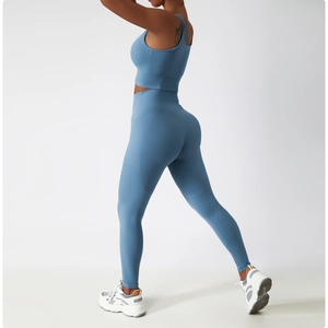 Detail of high-waist yoga pants in misty blue featuring a functional side pocket