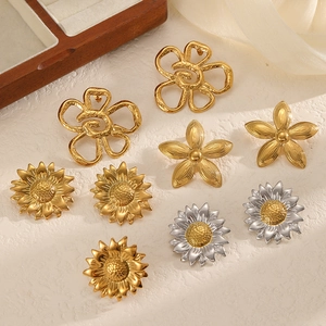 Assorted gold and silver floral stud earrings in 18k plated stainless steel on silk