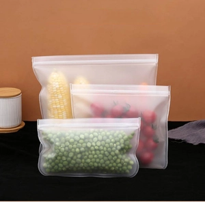 Three sizes of frosted PEVA food storage bags with corn, tomatoes and peas inside