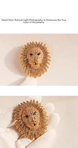 Detailed view of luxury gold-plated lion head brooch fully paved with sparkling zircons