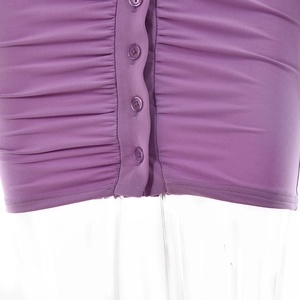 Detailed close-up of purple ruched fabric with matching buttons on a slim-fit dress