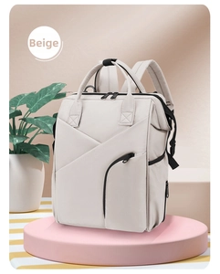 Detail of beige multifunctional mommy bag with geometric stitching and S-shaped shoulder straps
