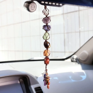 Detailed view of handmade Seven Chakra natural gemstone car hanging with woven tassels