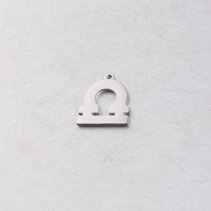 Macro view of 15mm mirror polished stainless steel zodiac omega symbol DIY pendant