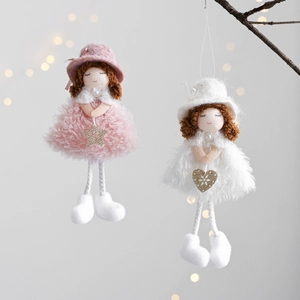 Detail of plush Christmas angel dolls with glittering stars and heart accessories