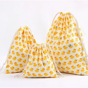 Three-piece set of drawstring organizer bags with yellow duck prints in various sizes