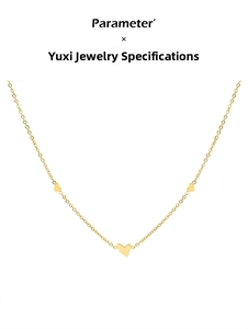 Close-up of minimalist 18K gold titanium necklace featuring three small heart pendants