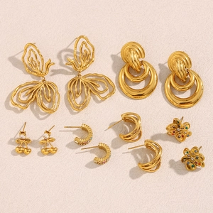 Detailed collection of 18K gold plated earrings featuring floral, cherry, and hoop designs