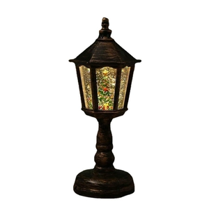Vintage bronze Christmas lantern with LED light and swirling glitter snow effect