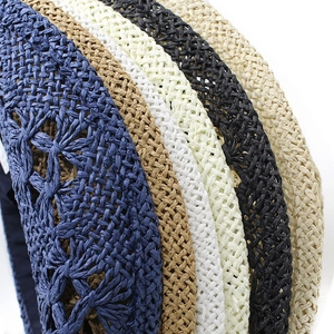 Detail of hand-woven straw texture and color options including navy, beige, and coffee