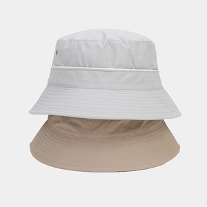 Detail of waterproof bucket hats with durable stitching and quick-dry fabric textures