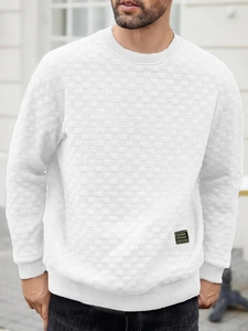 Detail of white slim-fit crew neck sweatshirt with textured checkerboard embossed fabric