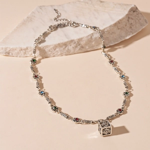 Retro silver necklace with colorful gemstones and a 3D square cross pendant