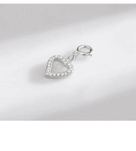 Detailed view of S925 sterling silver hollow heart pendant with pave cubic zirconia