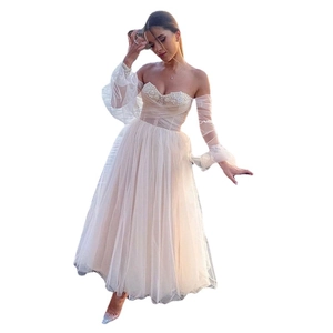 Elegant white off-shoulder evening dress with puff sleeves and beaded mesh skirt