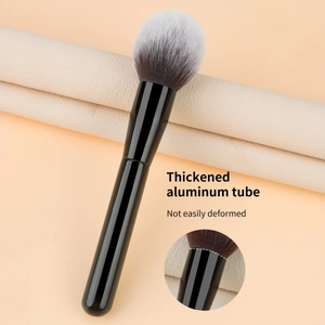 Detail of thickened aluminum ferrule on large powder brush with gray gradient bristles