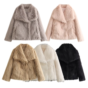 Flat lay view of faux fur coats in grey, pink, camel, white and black colors