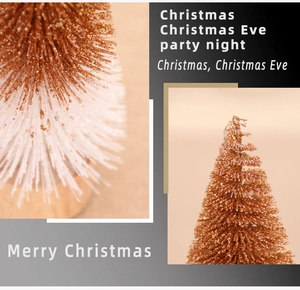 Close-up of glittered rose gold and white mini Christmas tree with a wooden base