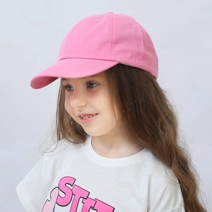 Close-up of pink cotton baseball cap for kids showing the minimalist brim and stitching