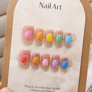 Handmade cat eye press-on nails featuring cute colorful 3D crystal turtle decorations