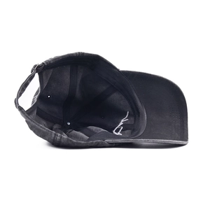 Detail of dark gray washed cotton baseball cap with six-panel structure and metal buckle