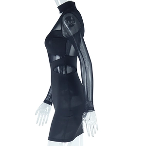 Detail of mesh paneling and sheer long sleeves on a black bodycon dress