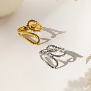Minimalist geometric teardrop ring with hollow cross design in gold and silver finish