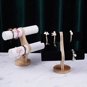 Two-tier bamboo jewelry stand for bracelets and watches with white and black velvet rolls