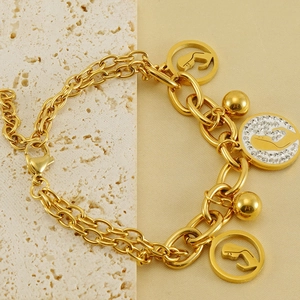 Detailed close-up of 18K gold-plated double-layer bracelet with hollow silhouette charms