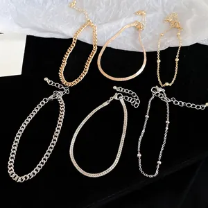 Three-piece gold and silver snake chain bracelet set with Cuban and bead link styles