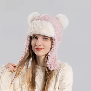 Winter plush pink and beige trapper hat with bear ears and faux fur earflaps