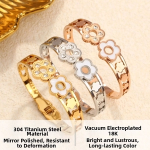 Detailed macro view of triple heart bangles in 18K gold-plated 304 stainless steel