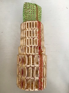 Detailed close-up of lipstick clutch featuring Leaning Tower design and colorful crystals