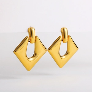 Detailed view of minimalist 18K gold geometric hollow rhombus drop earrings with glossy finish