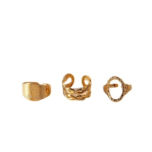Three-piece gold stainless steel open ring set with textured and braided chain designs