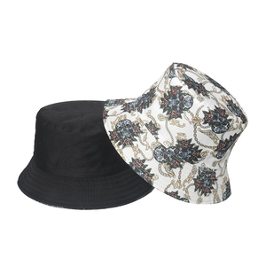 Punk style bucket hat set in black and skull rose print with metal chain pattern