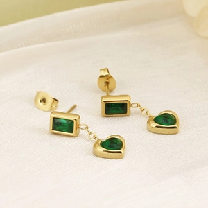 Detail of 18K gold drop earrings featuring emerald green heart and square zircon stones