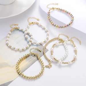 Detail of elegant pearl bracelet set with butterfly pendant and adjustable lobster clasp